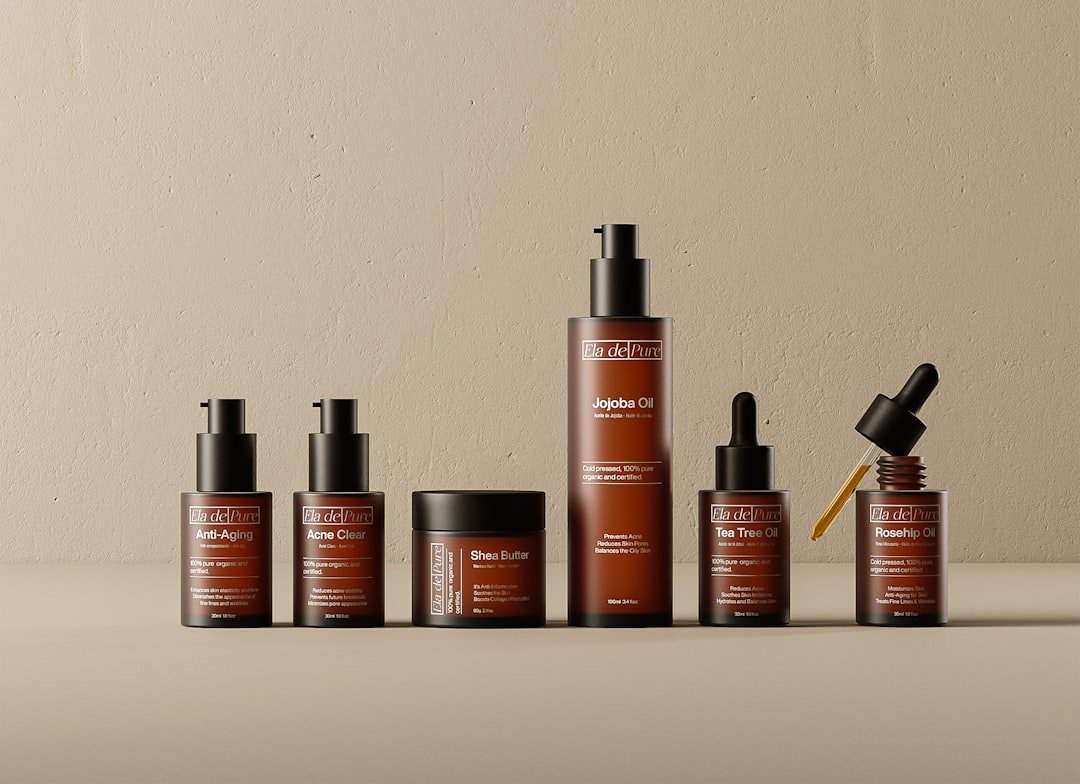 A flat lay of skincare products including cleanser, moisturizer, and sunscreen on a marble surface with natural light.